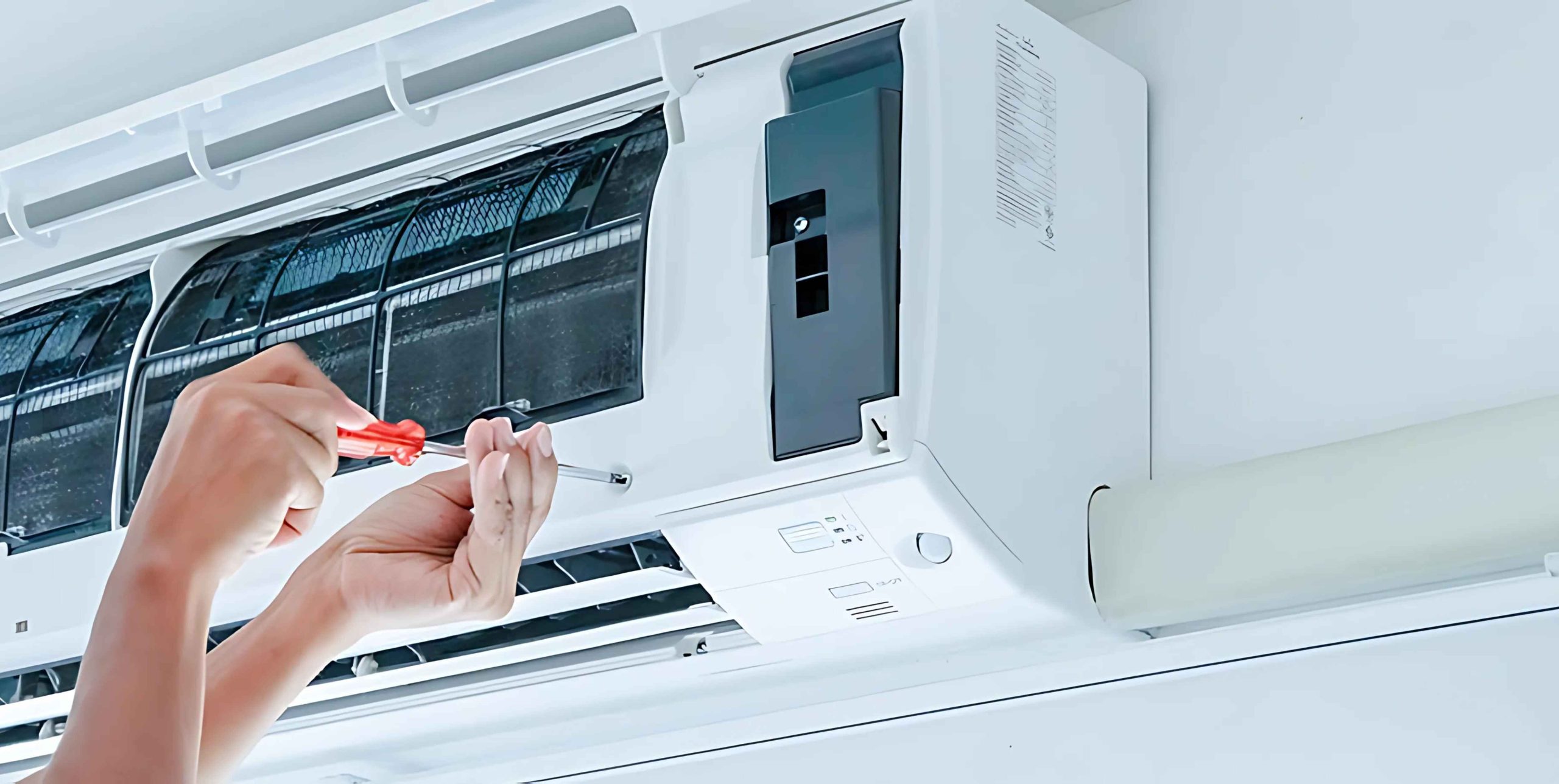 An AC technician is installating AC in riyadh city