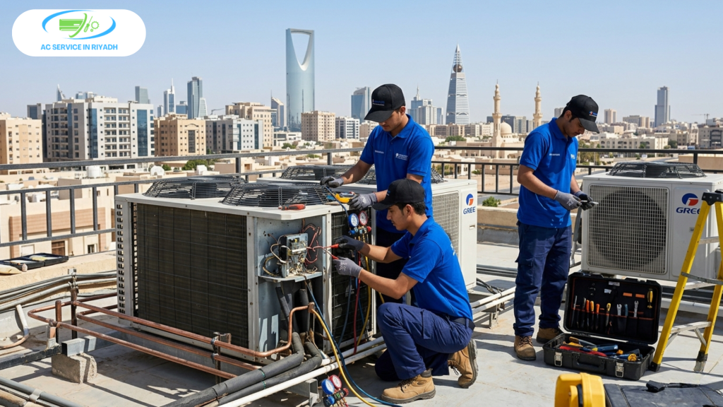 Professional AC repair team in blue uniforms working on a rooftop unit with the Riyadh skyline and Kingdom Centre in the background.